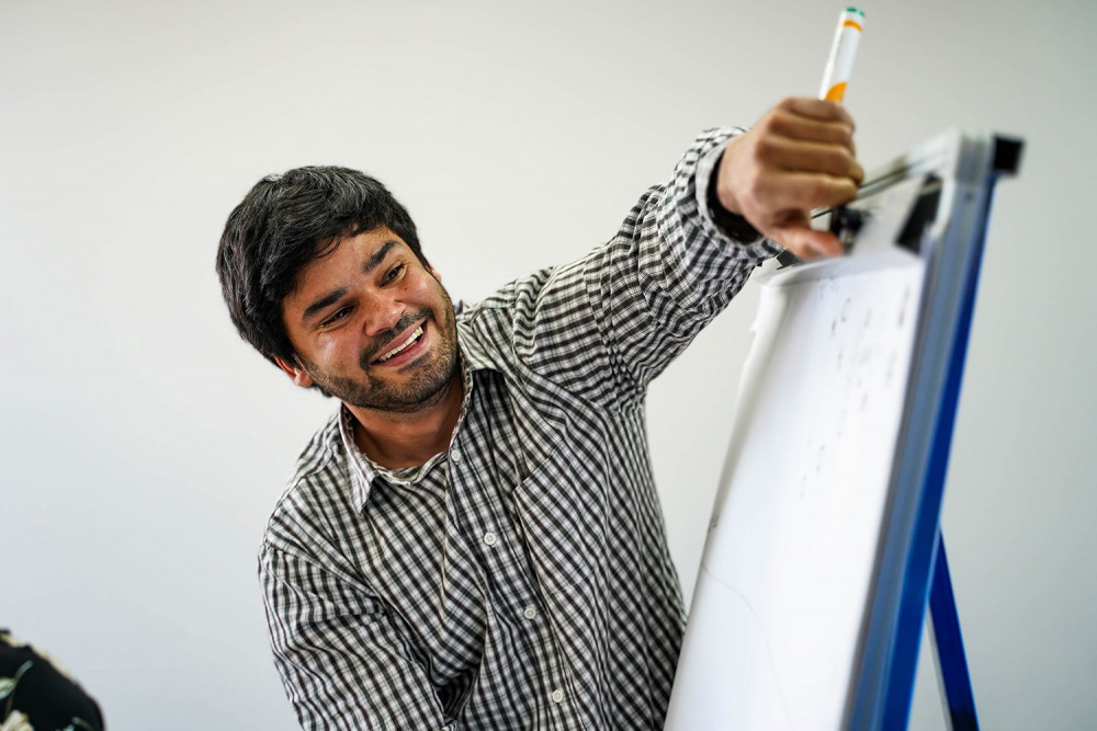 Man Writing On A Whiteboard