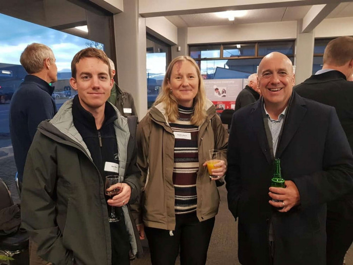 Three People Enjoying A Drink at a Business Event