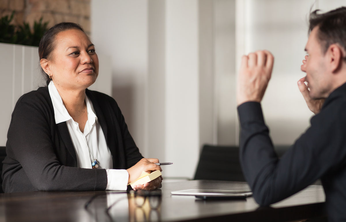 Maori Women Discussing with Man